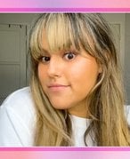 Picture of an editor with bangs on a pink and blue gradient background