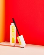 Maybelline New York The Colossal Curl Bounce Mascara on a red background 