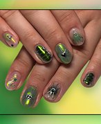 Nails painted with green builder gel polish collaged on a green graphic background