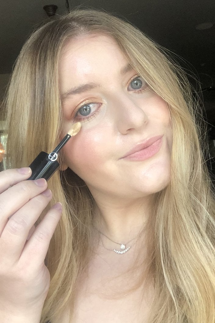 person applying Giorgio Armani Luminous Silk Concealer under eye