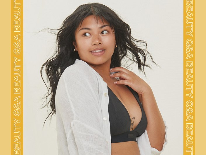 person touching their decolletage