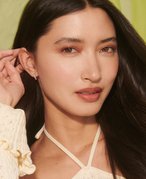 Picture of a model with dark, curled hair