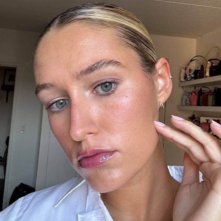 Editor with her blonde hair pulled back wearing a nighttime eye makeup look
