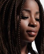 person wearing box braids