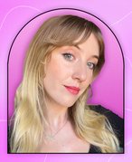 Picture of an editor on a pink graphic background