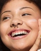 Woman with sunscreen on face