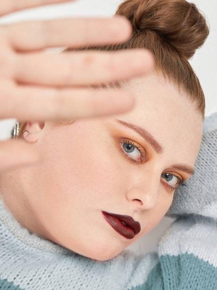 person with fair skin tone wearing dark lipstick