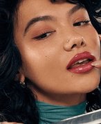 Woman with brown hair and drugstore makeup